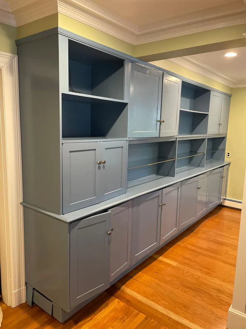 Built-in wall unit refinished from dark mahogany to soft grey
