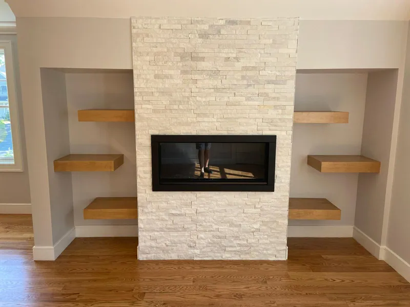 Stone fireplace & floating shelves